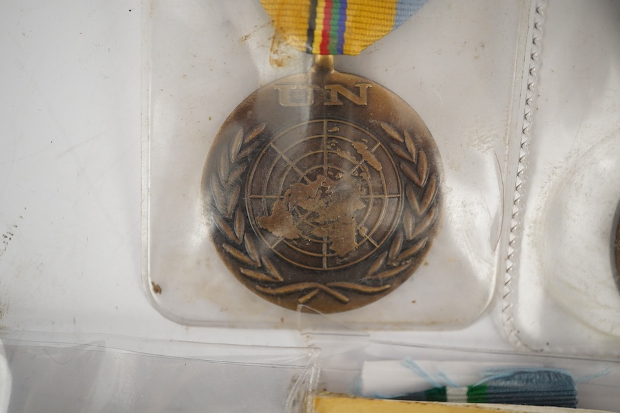 Thirteen United Nations (UN) and NATO medals, eleven UN examples with ‘ in the service of peace’ to the reverse, including a variety of ribbons for a number of different campaigns, (some duplicates), and two NATO ISAF Af